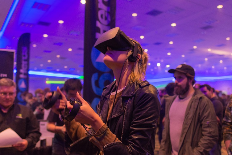 A Visitor of a Product Trade Show with a VR Headset On