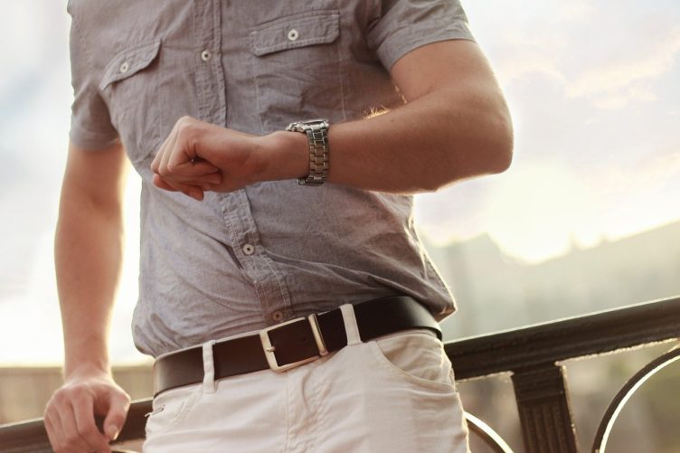 A Marketing Specialist Checking Time on His Watch