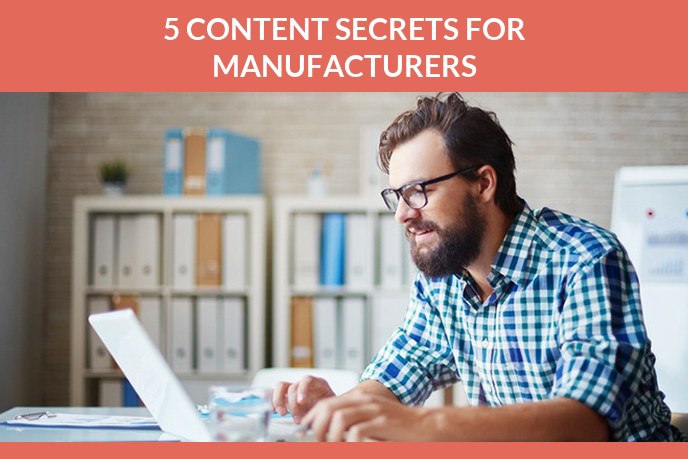 Content marketing for manufacturers: Man in a checked shirt working at a laptop in an office with document files behind him