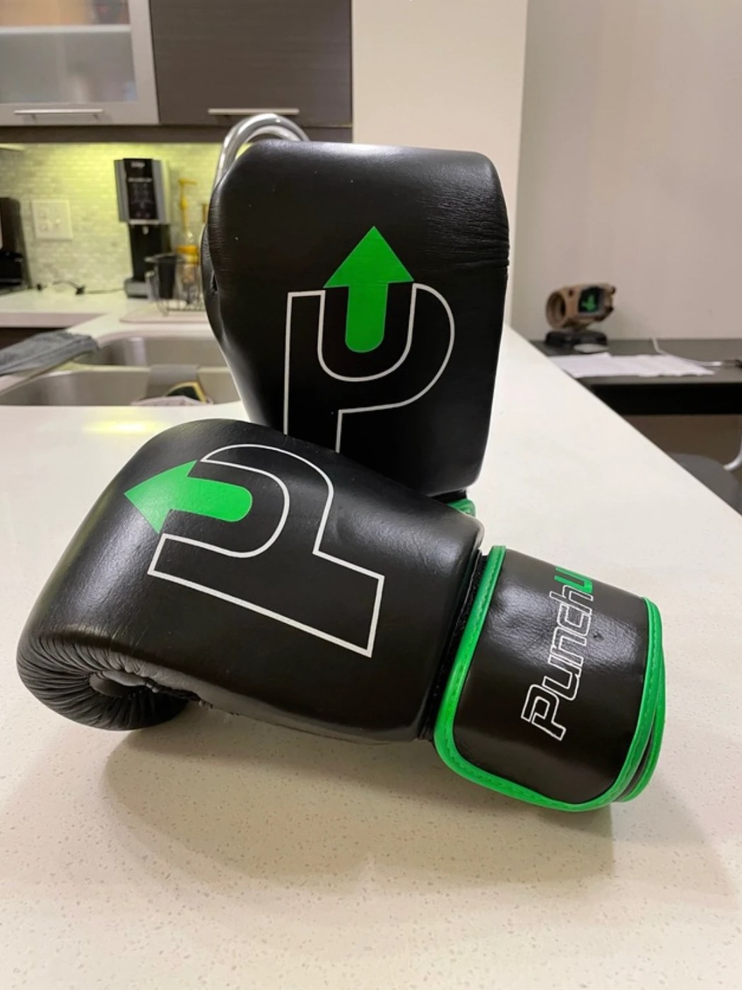 Client photograph of the boxing gloves at an angle on a counter