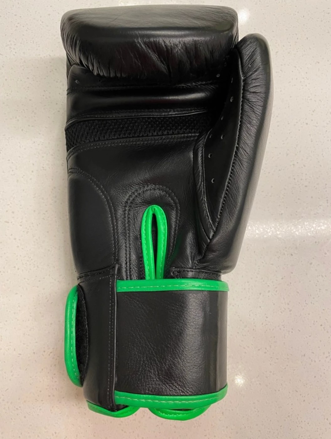 Client photograph showing the side and palm of the boxing glove