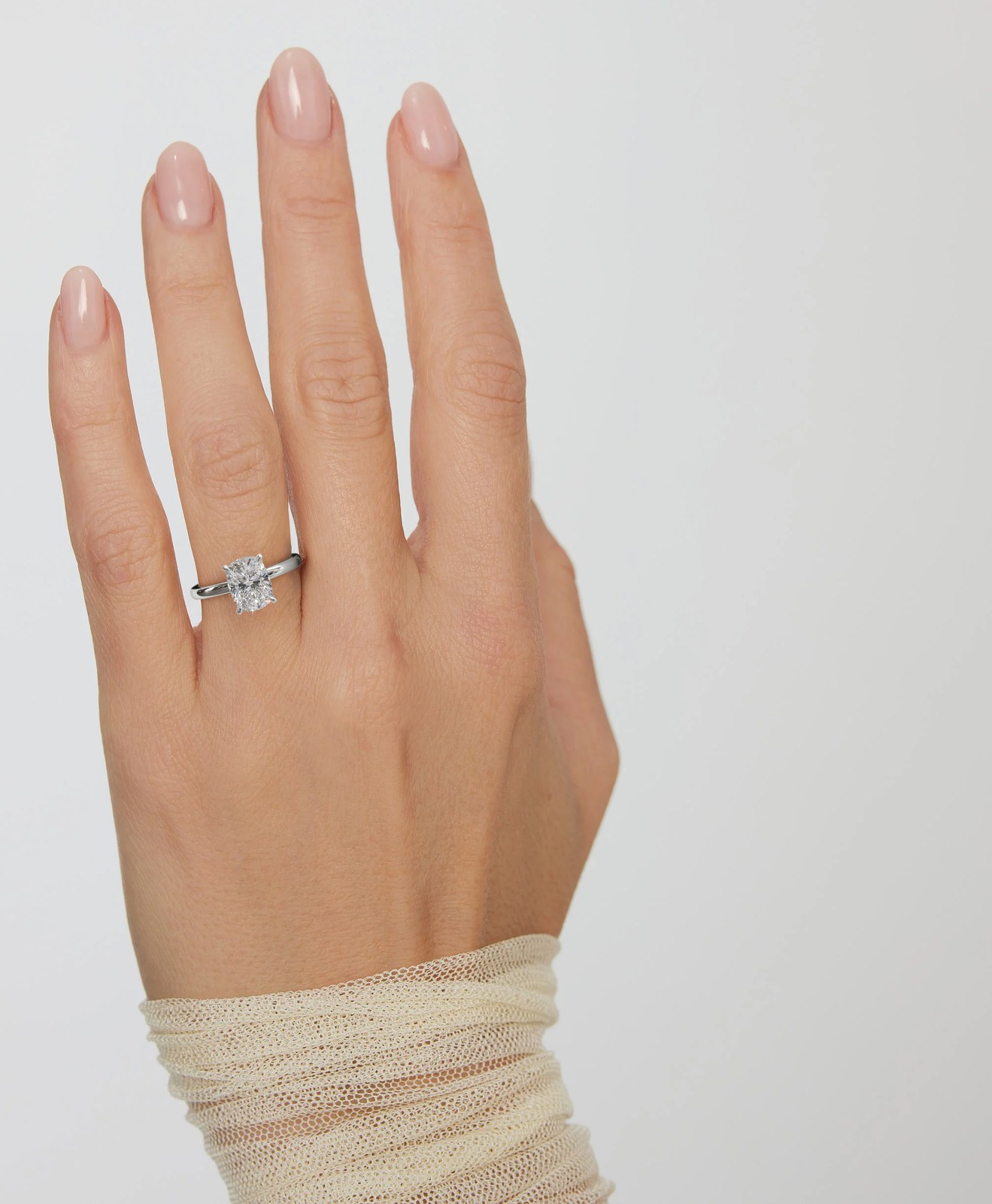 The white gold ring rendered on a hand