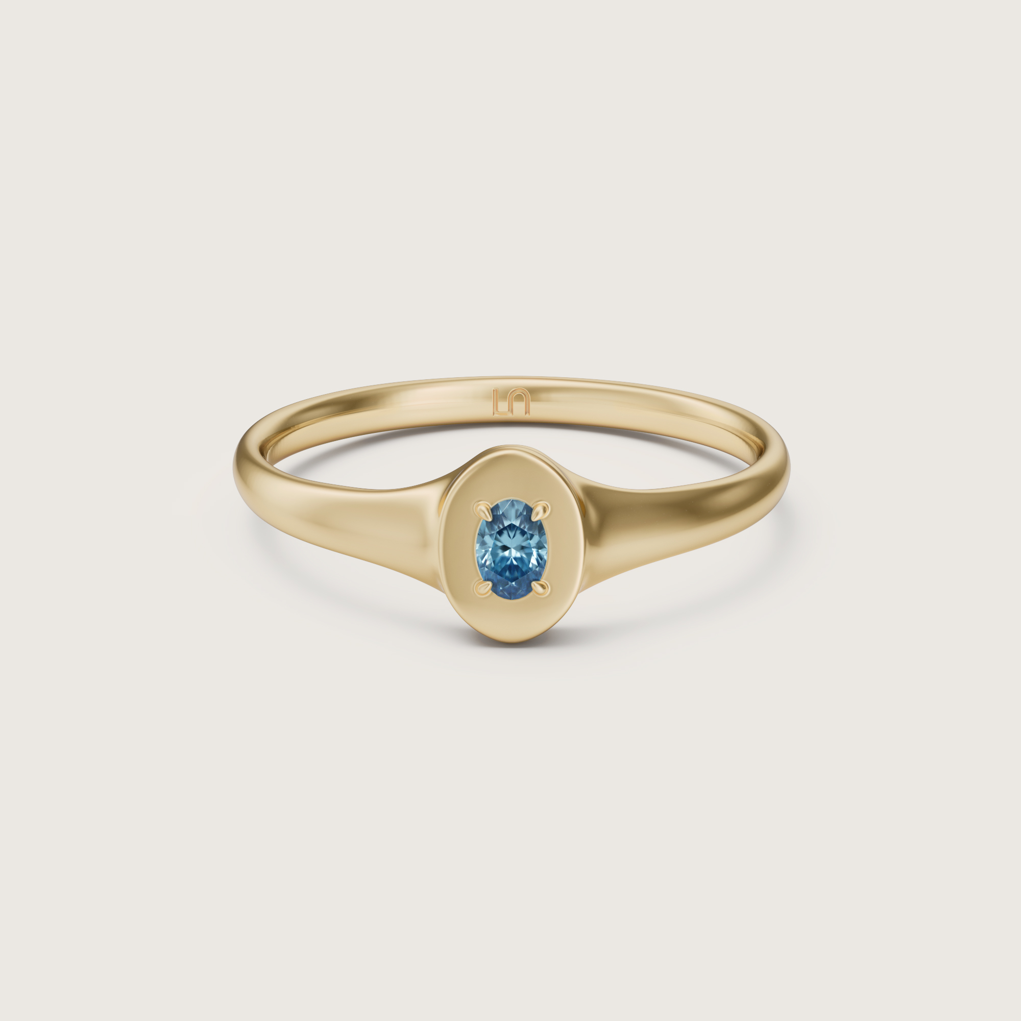 3D render of the Lindelli Birthstone Mini Signet ring in yellow gold with an oval aquamarine