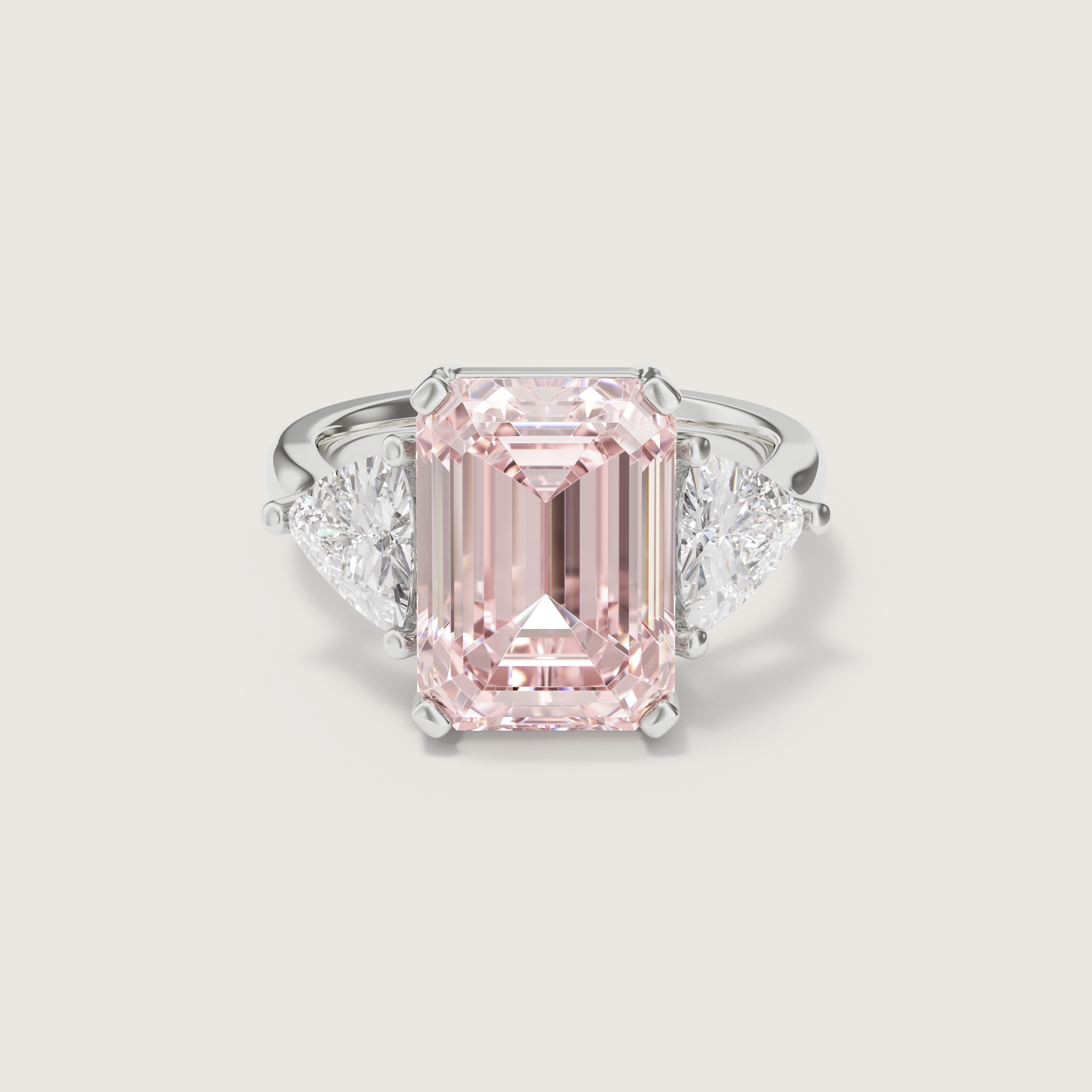 3D render of the Lindelli Cabana trilogy ring with a pink emerald-cut center diamond and pear side stones in white gold, flat view